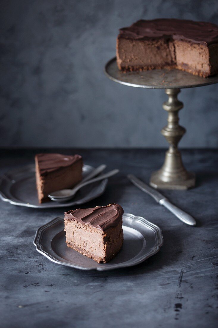 Sliced chocolate cheesecake with chocolate ganache