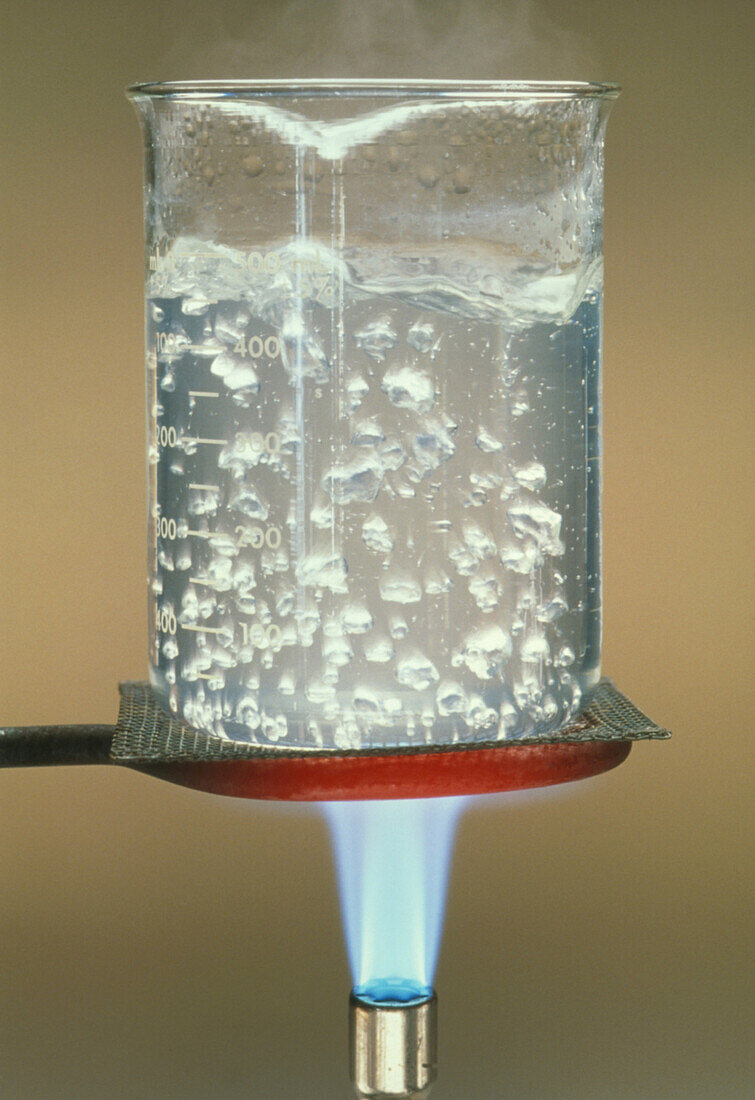 Water boiling heated by bunsen burner