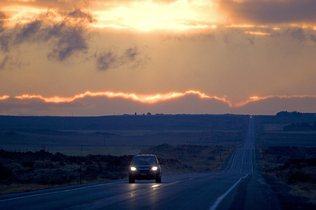 Car driving at sunset