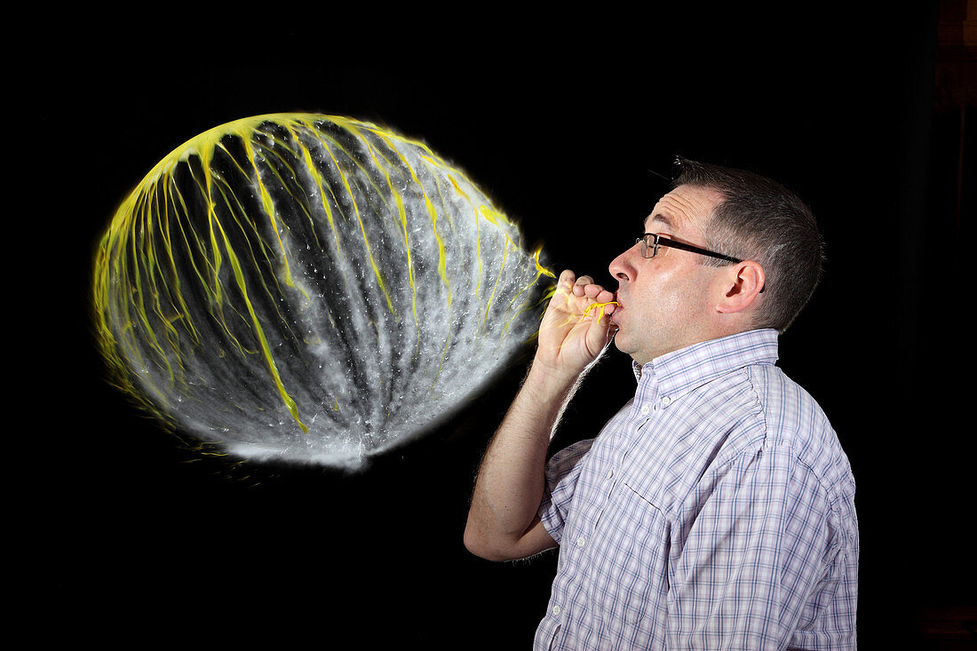 Man Over-Inflating Balloon