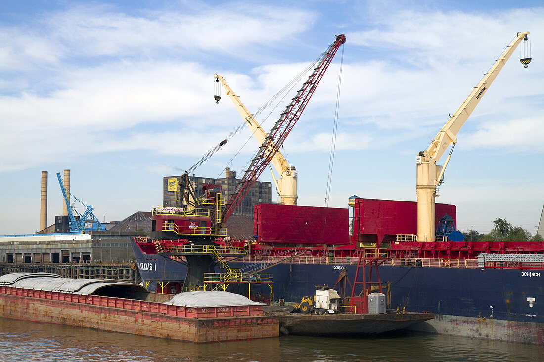 Crane Loading a Barge with Coal