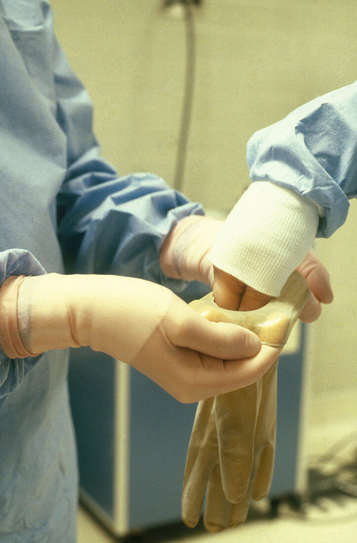 Nurses Putting on Rubber Gloves