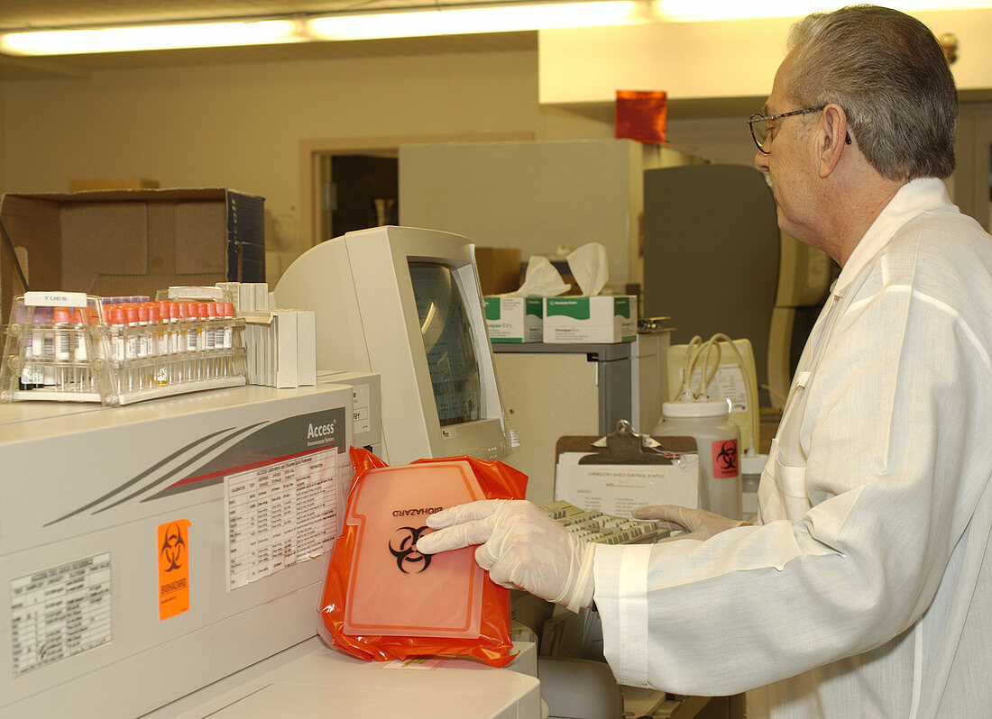 Medical technologist entering blood data