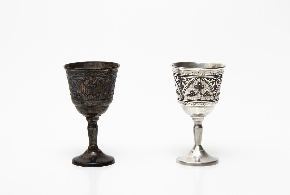 Tarnished and cleaned silver cups