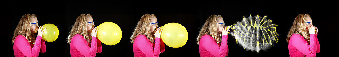 Girl bursting a balloon