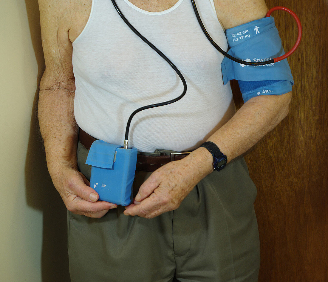 Man Wearing a Blood Pressure Monitor