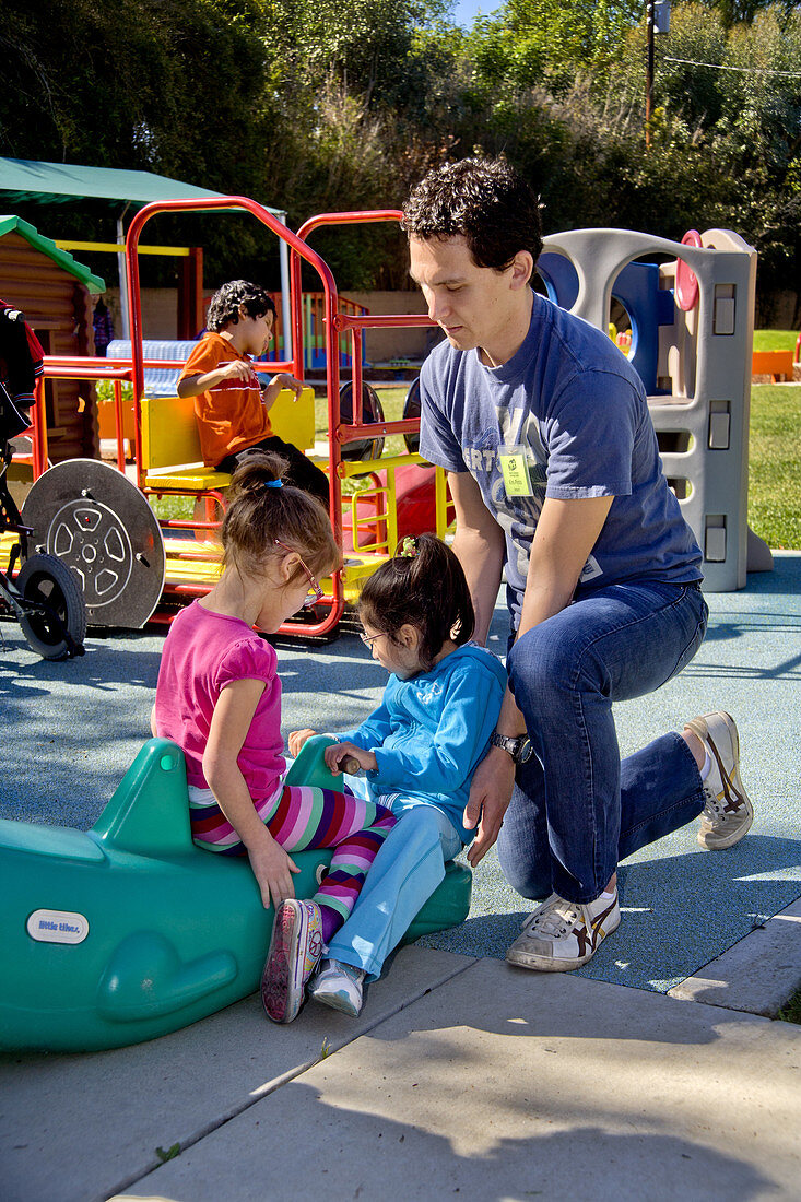 Helping Disabled Children at Playground