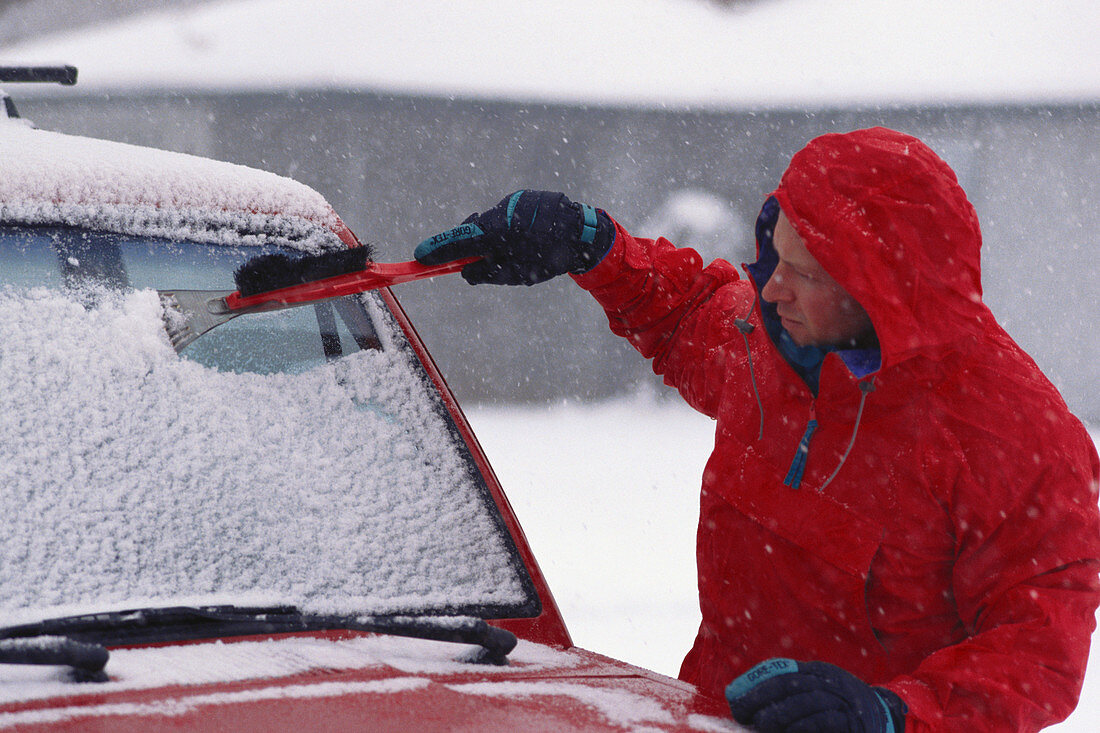 Scraping Snow off Windshield