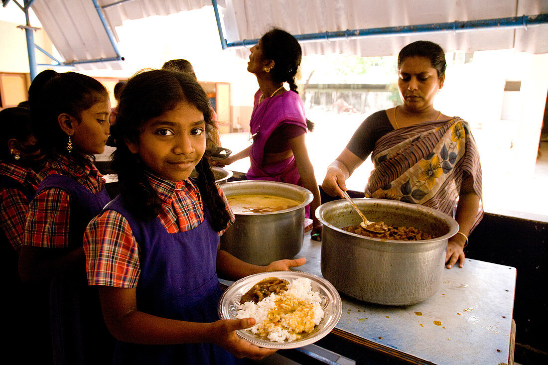 Uniformed Schoolgirl with Lunch,India