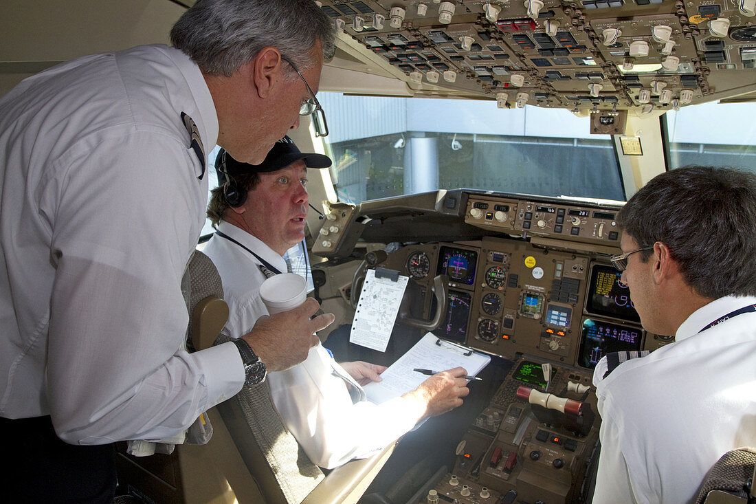 Pilot and First Officer in Cockpit