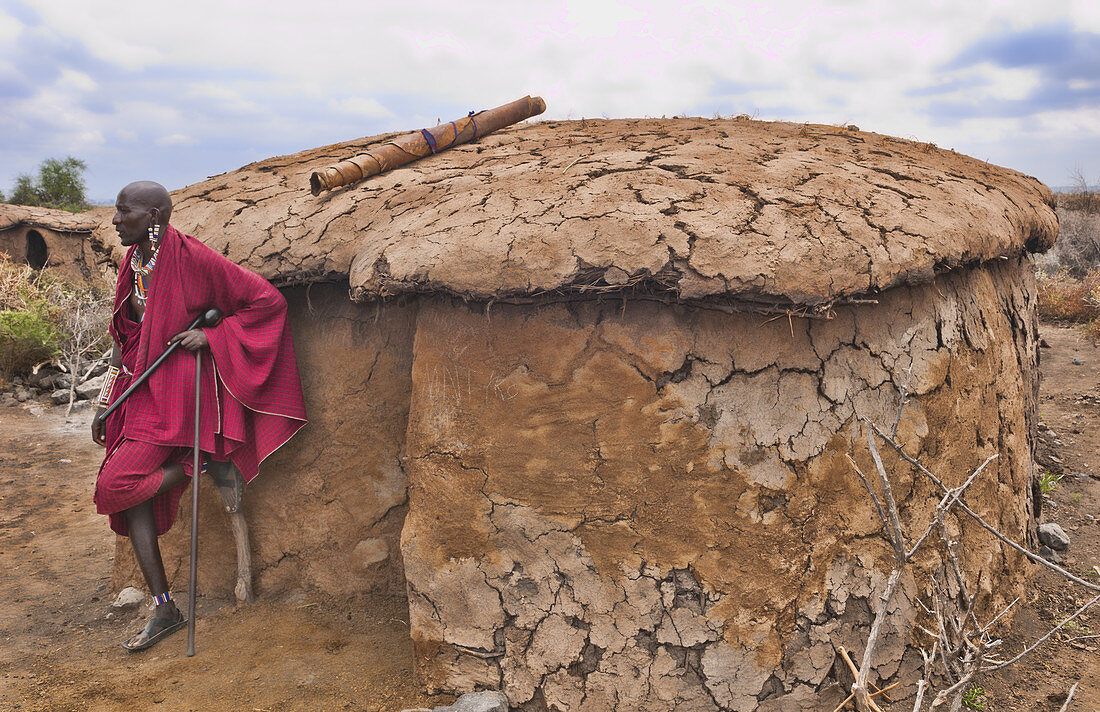Masai Man in front of Home,Kenya