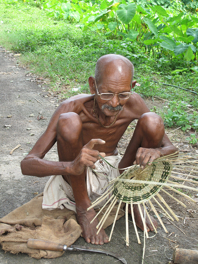 Old Villager Plaiting a Basket