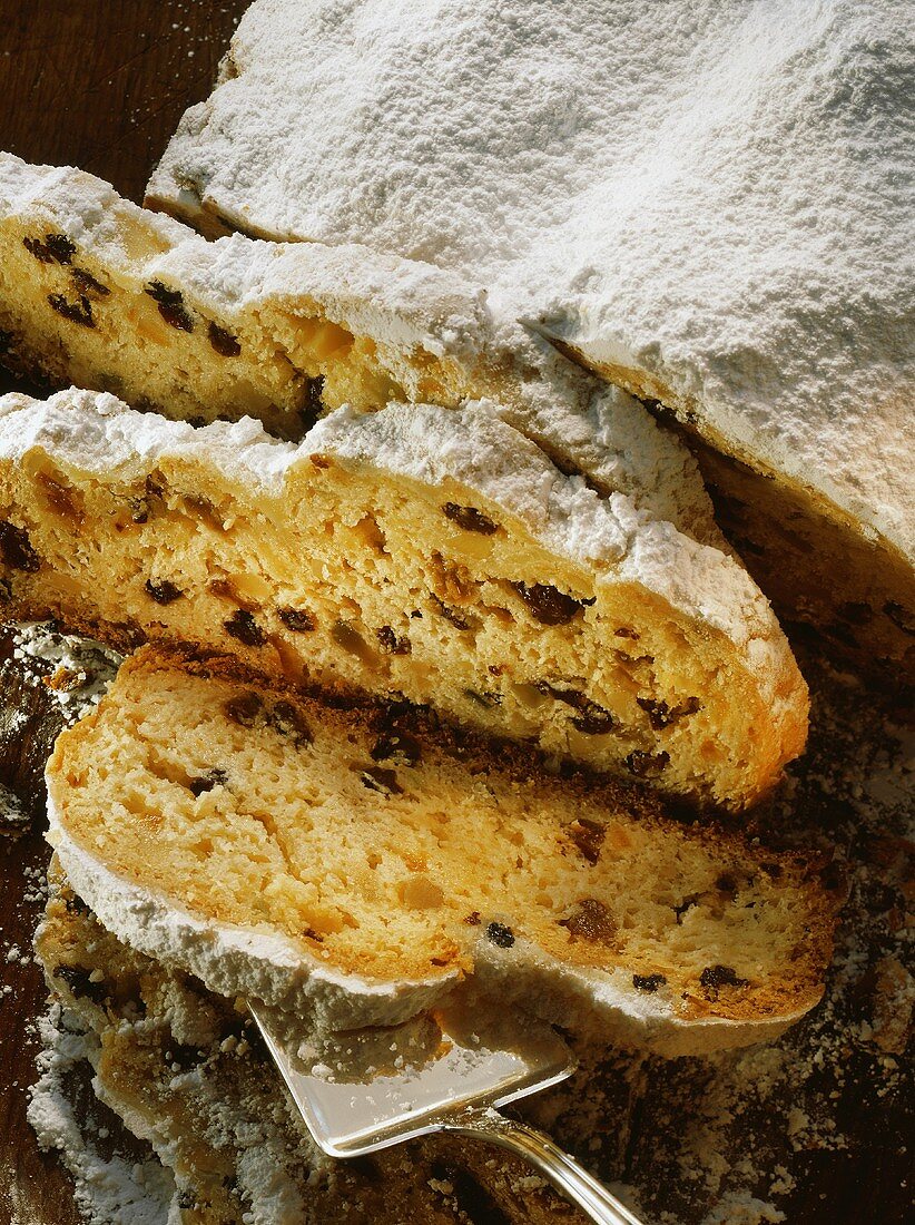 Dresden stollen, slices cut, on wooden platter