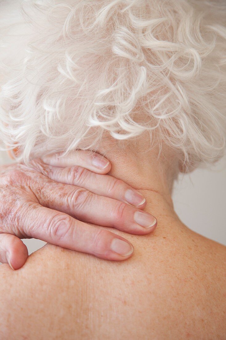 Elderly woman with neck pain