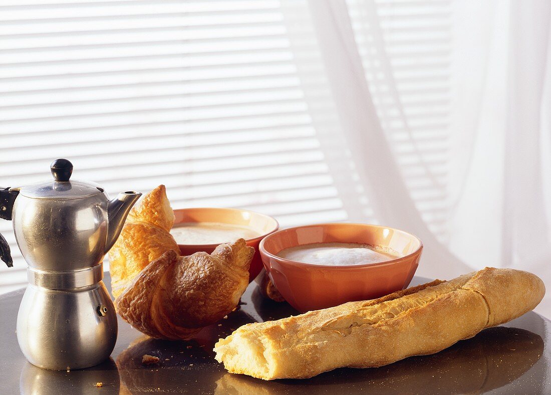 Breakfast with a Croissant, French Bread and two cappuccinos