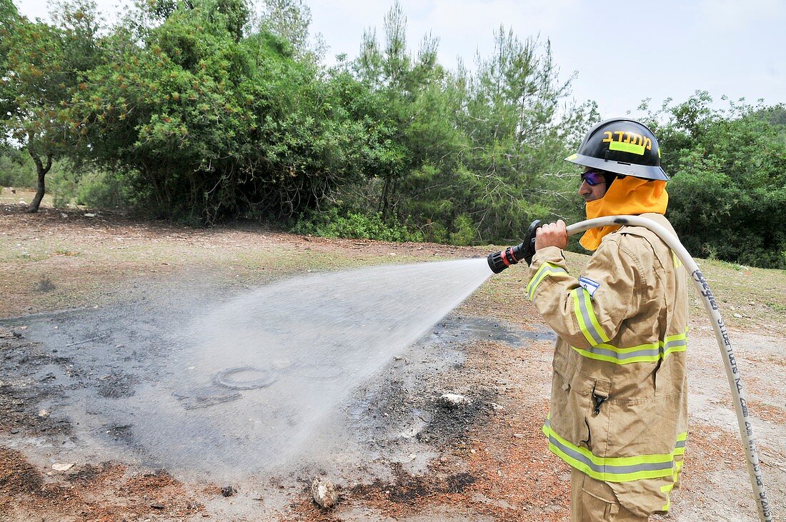 Fireman extinguishes a fire