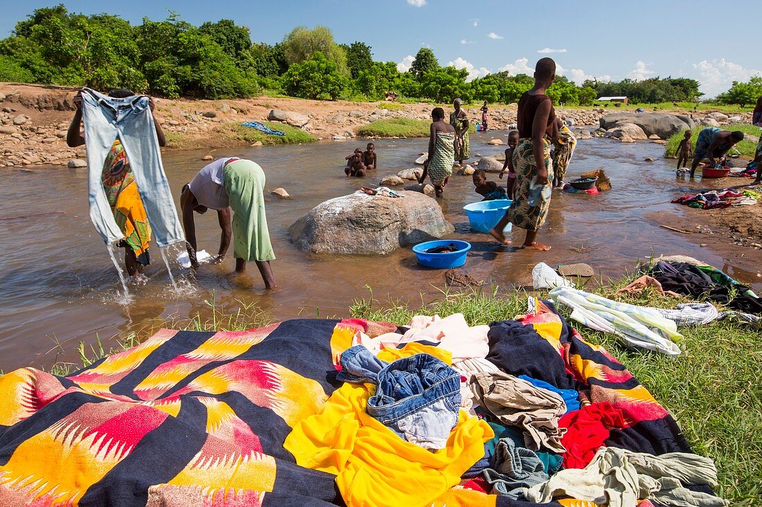 Women washing clothes in a river,Malawi