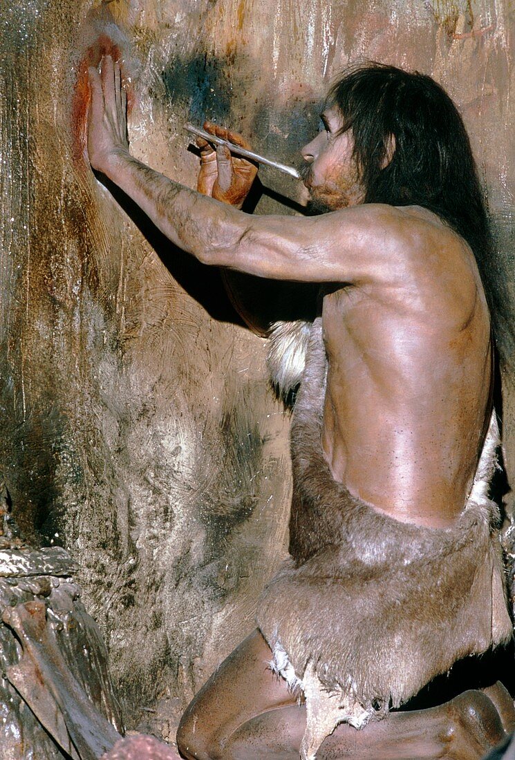 Model of a Cro-Magnon man doing a cave painting