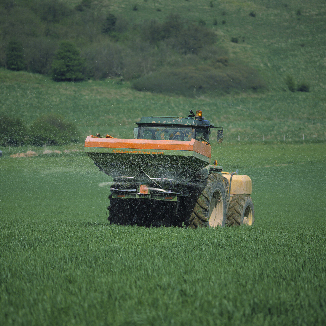 Tractor applying fertiliser