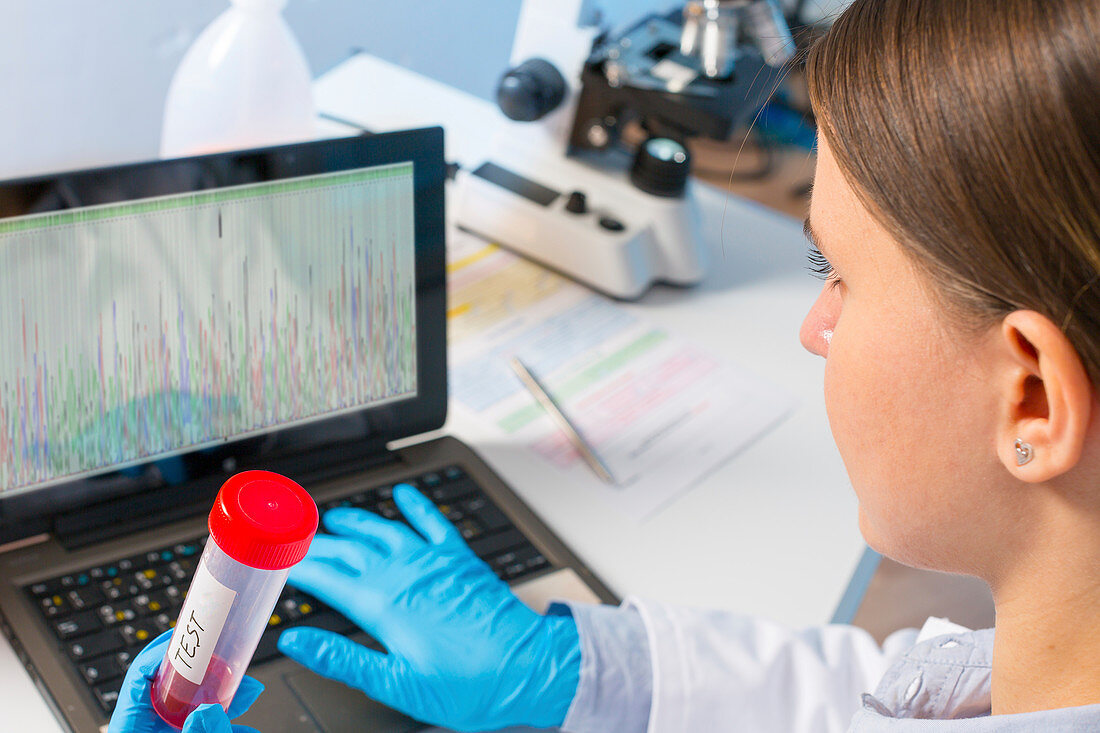 Lab technician using laptop