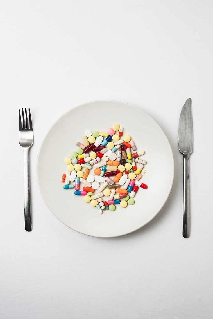 Plate with pills and cutlery