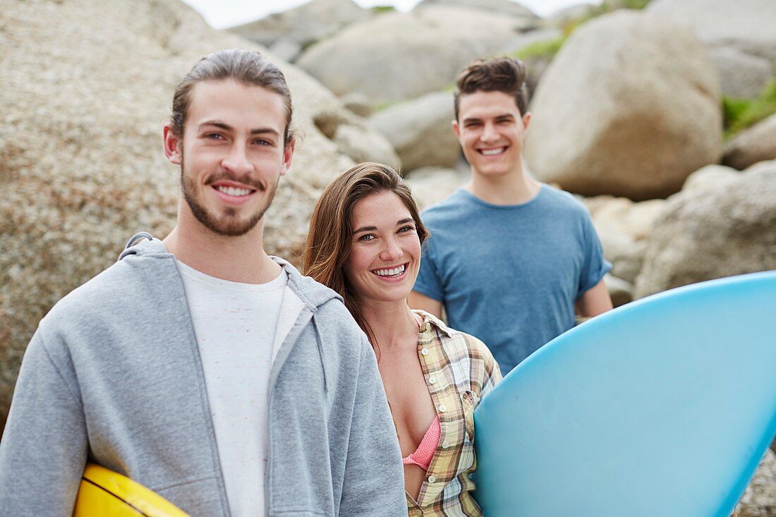 Young adults with surfboard