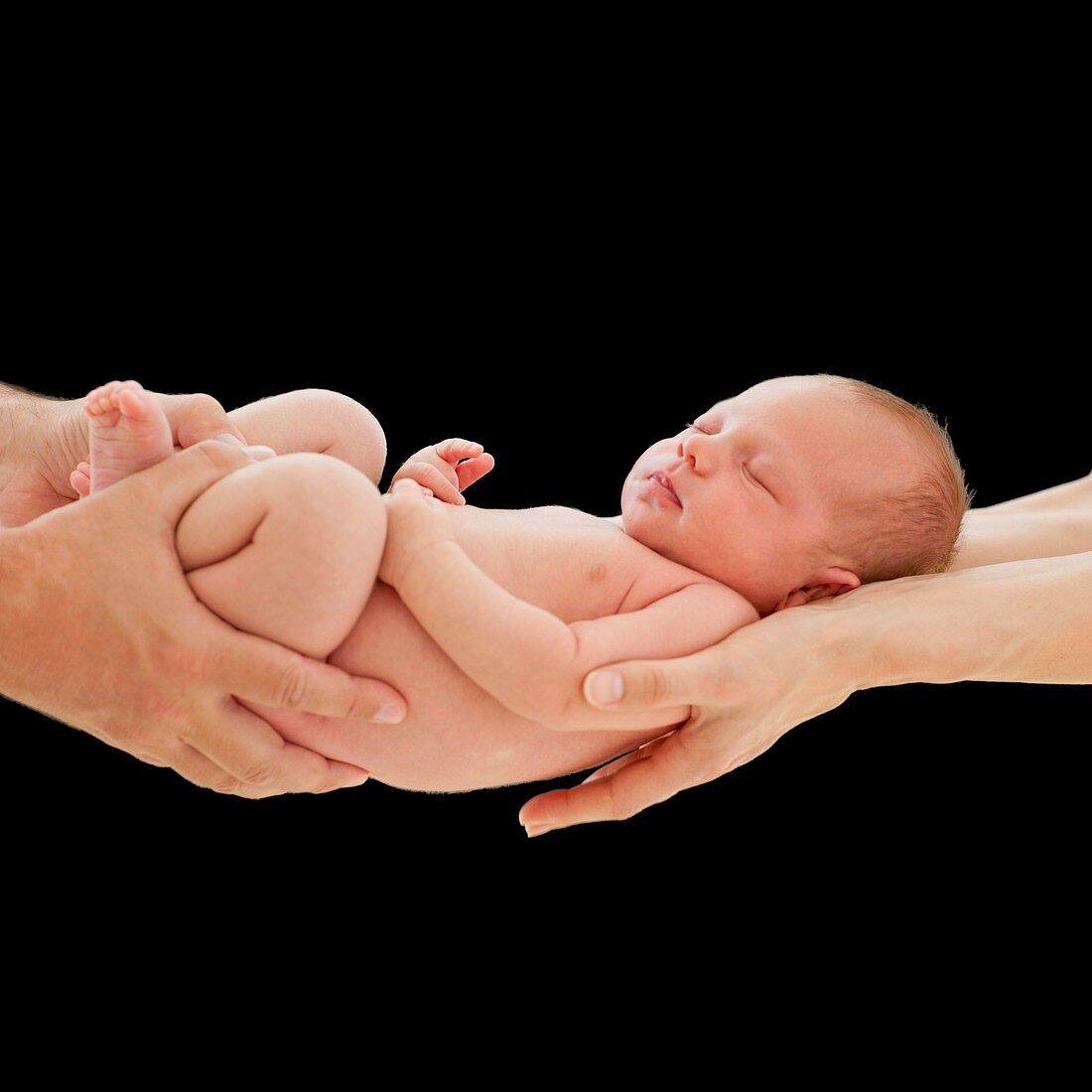 Parents holding newborn son
