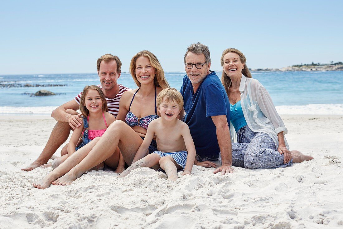 Family sitting on beach