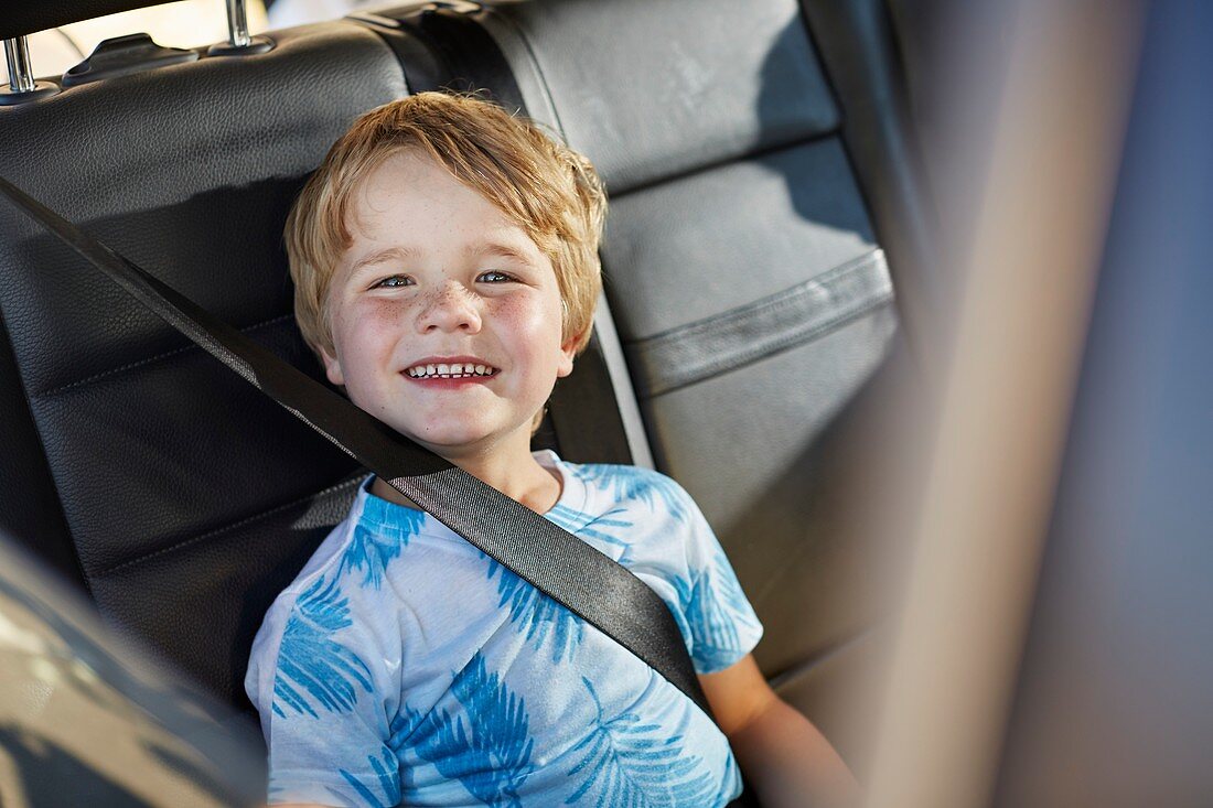 Young boy wearing seat belt