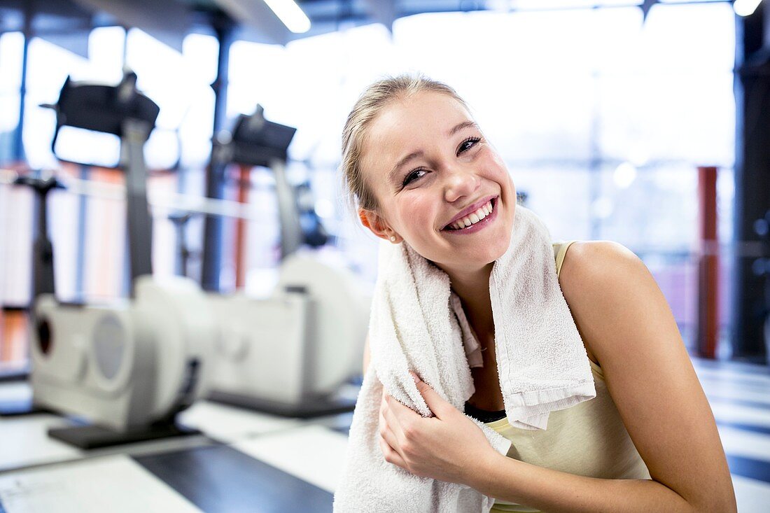 Woman wiping her sweat after exercising