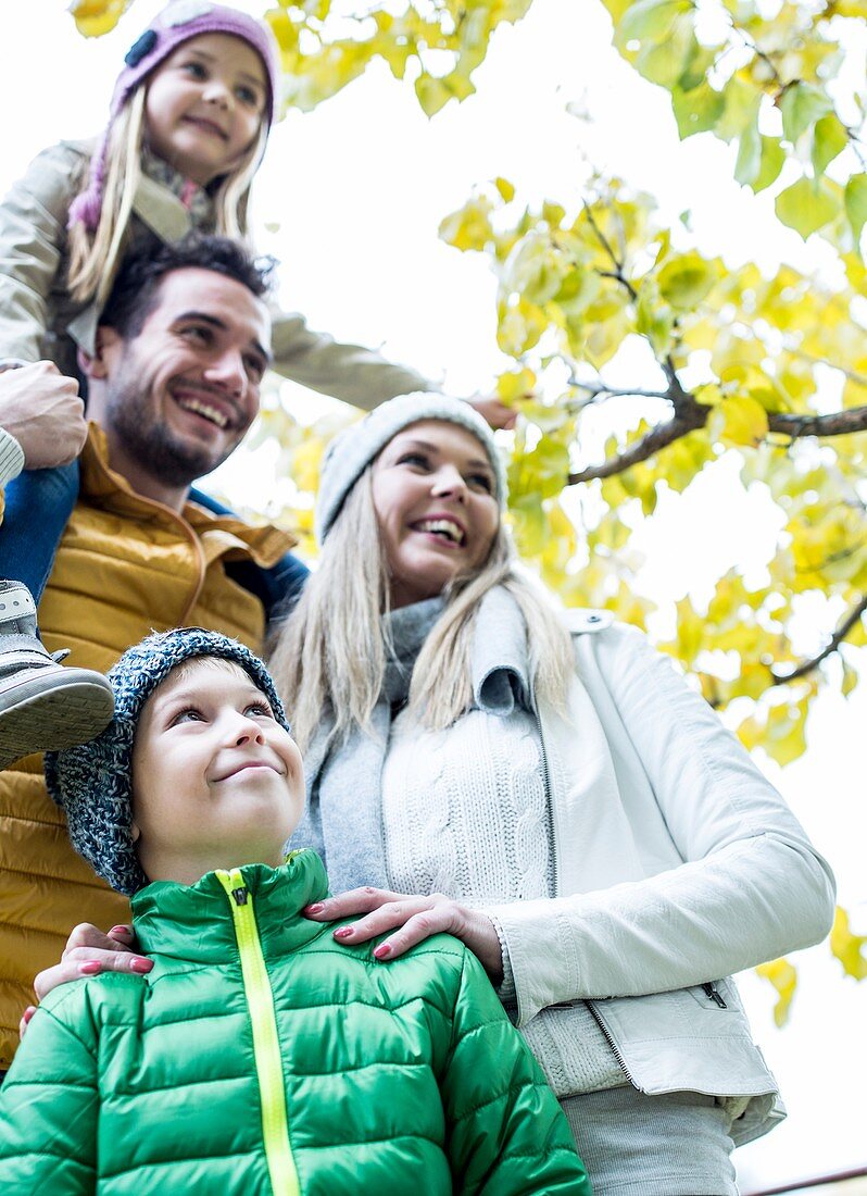 Family in park smiling together