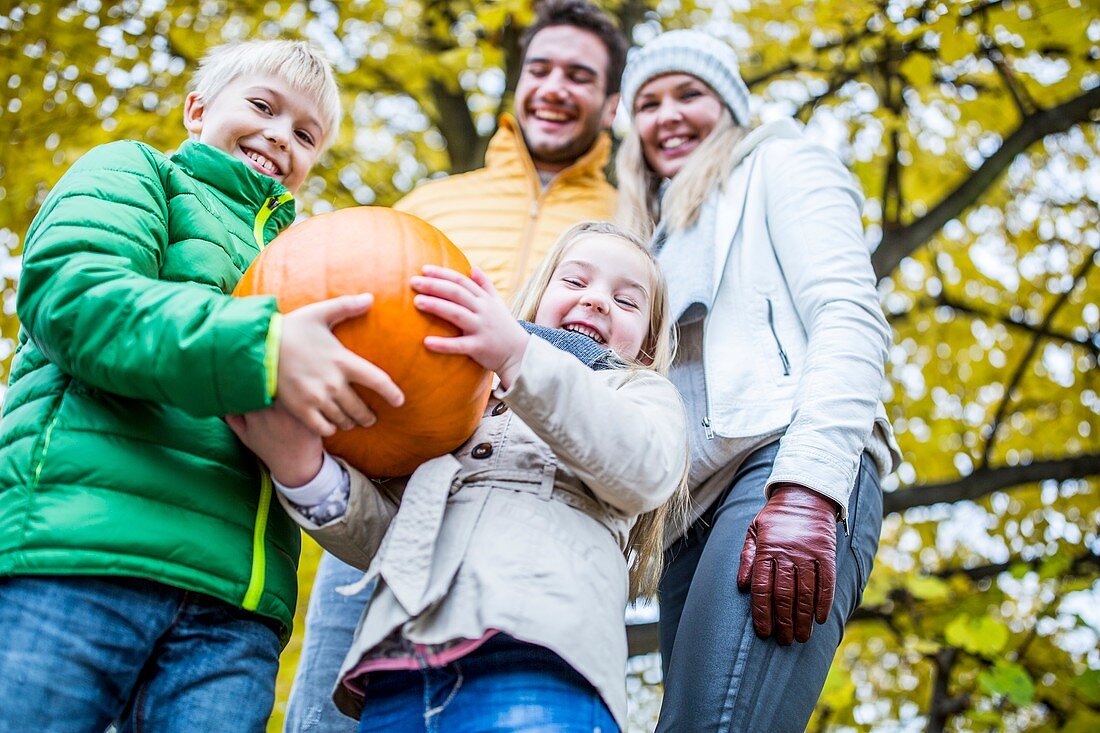 Children holding pumpkin