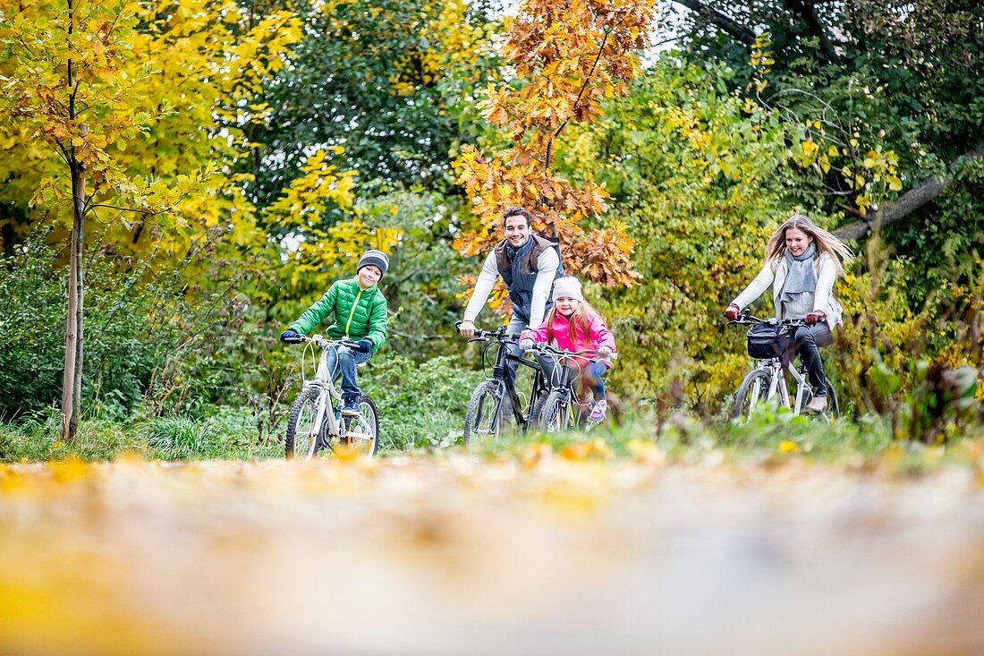 Family cycling together