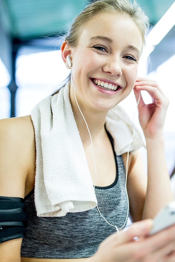 Woman adjusting headphones