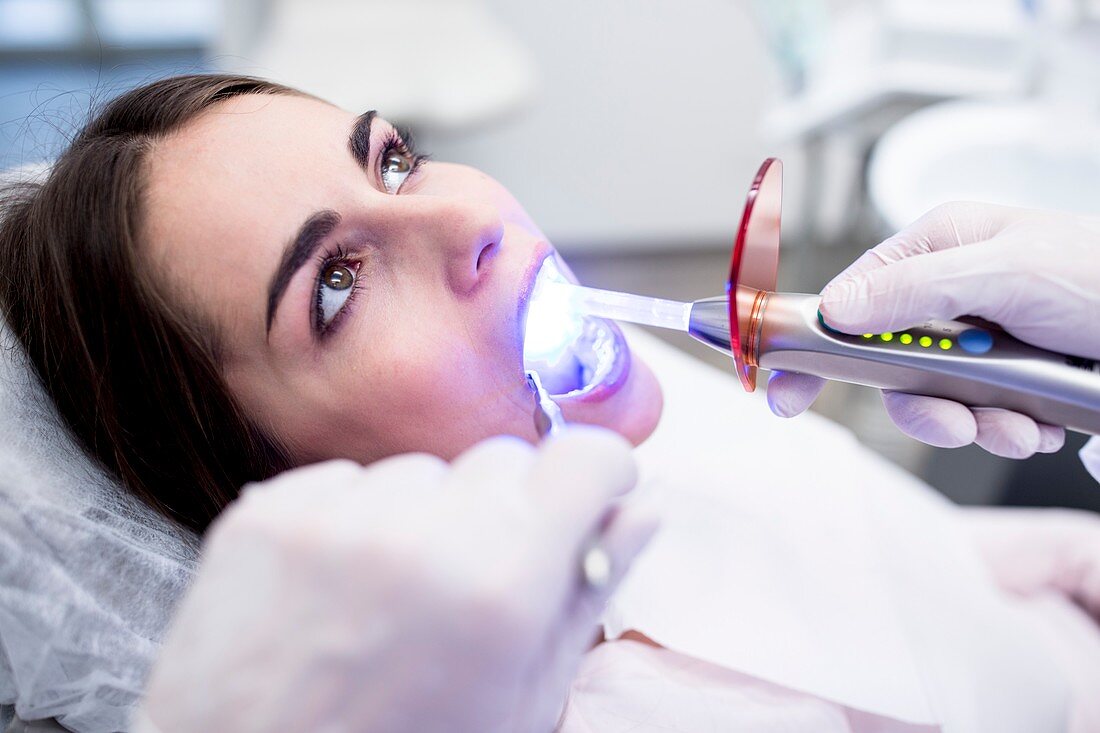 Dentist using ultraviolet light