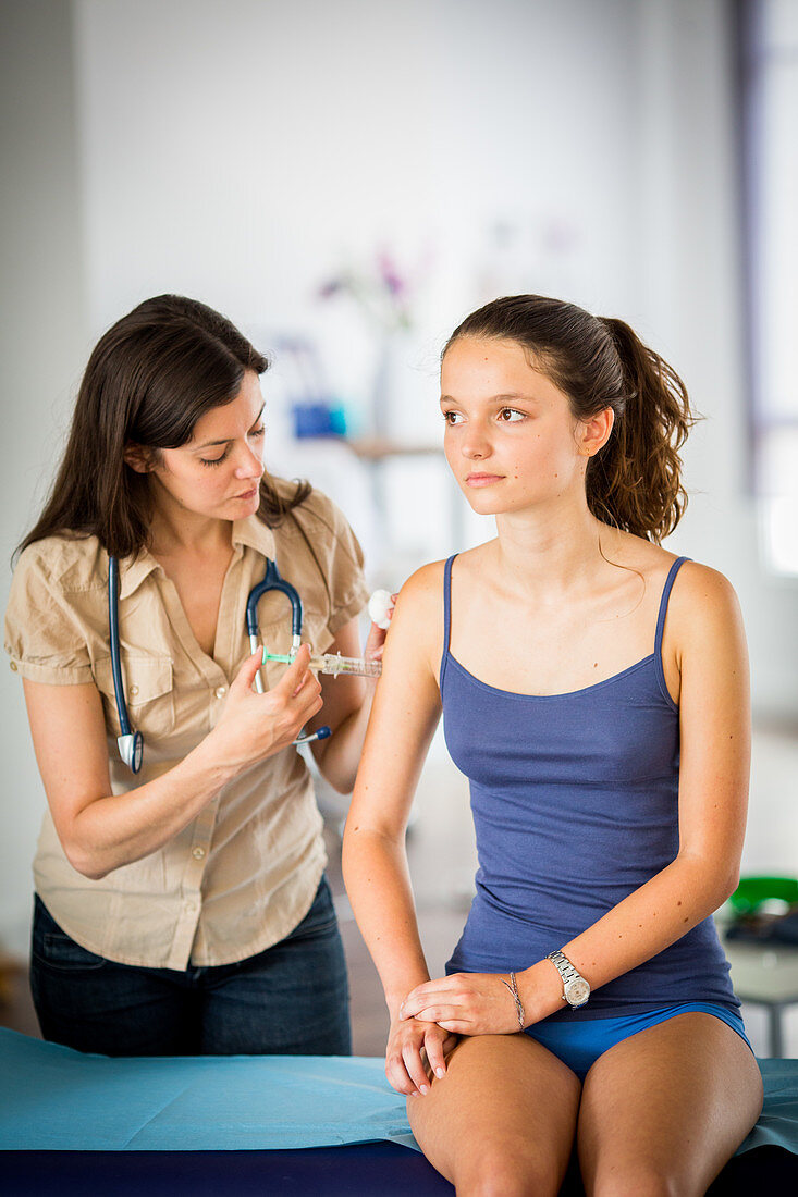 Teenage girl receiving Gardasil vaccination