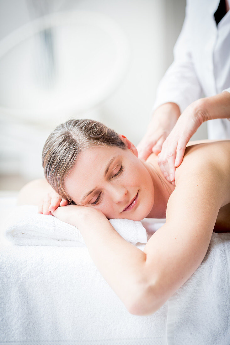 Woman receiving a back massage