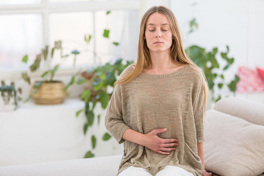 Woman doing breathing exercises