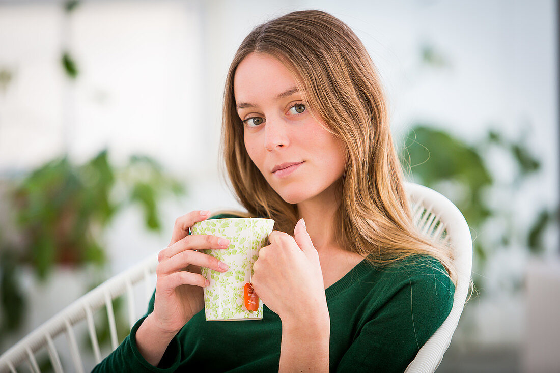 Woman drinking hot beverage