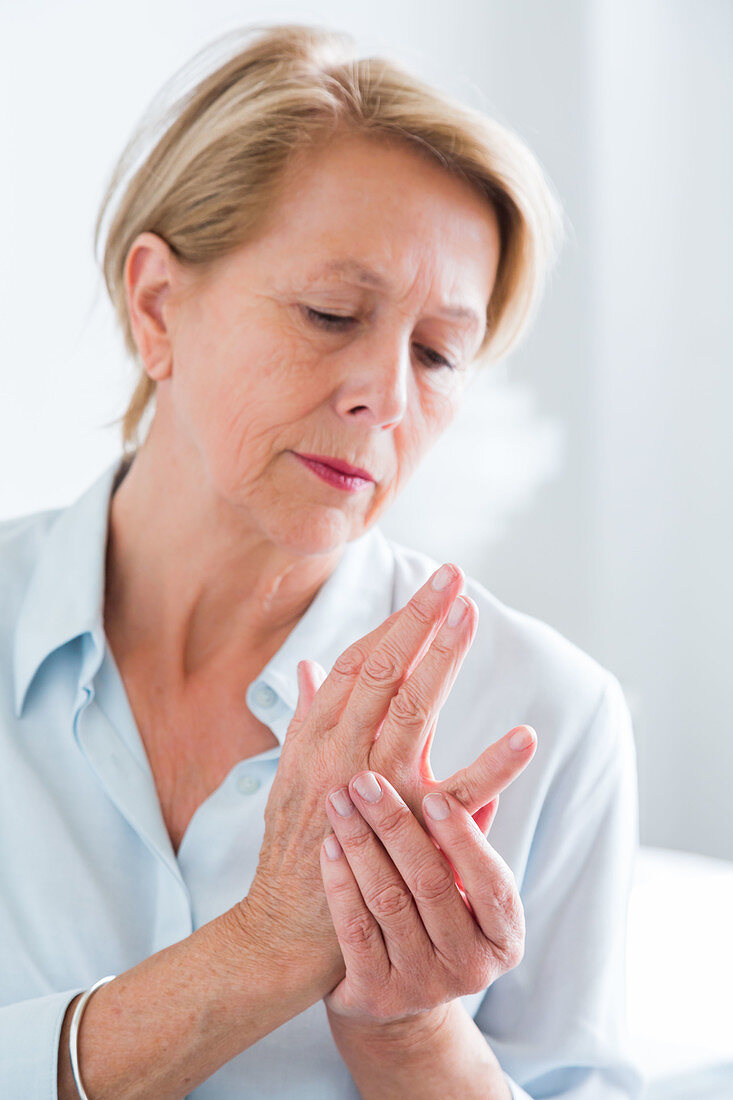 Senior woman suffering from articular pain