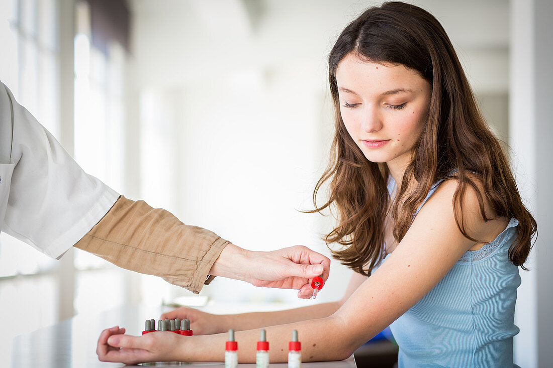 Teenage girl undergoing skin prick test