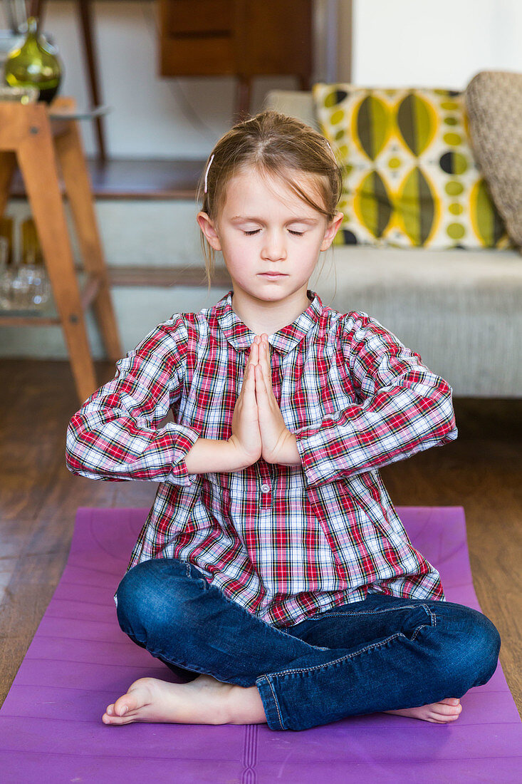 6 year-old girl practicing relaxation exercises