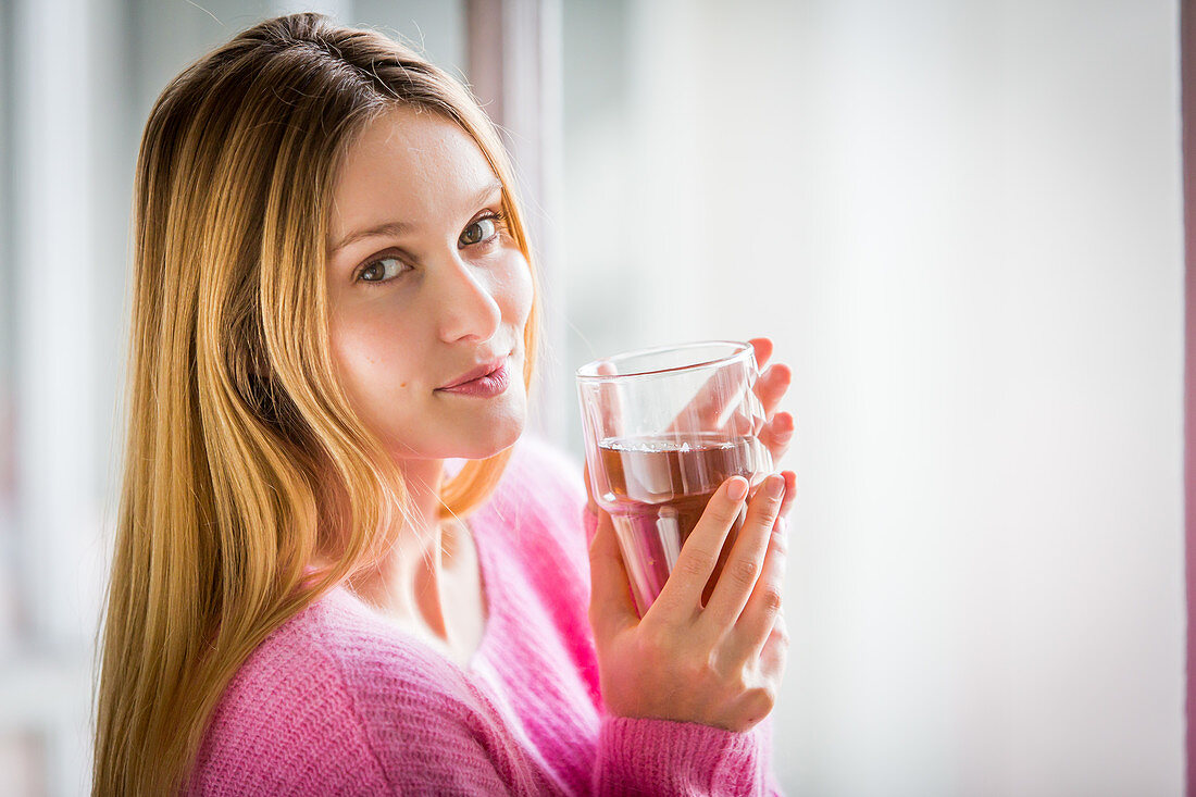 Woman drinking hot beverage