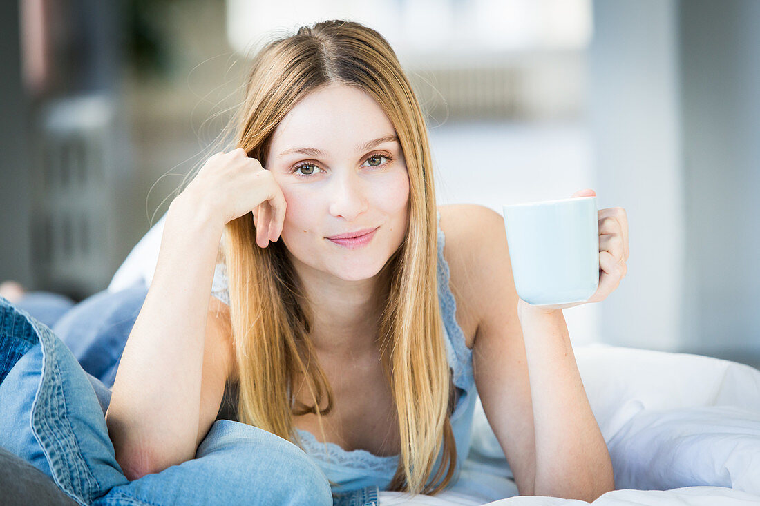 Woman drinking hot beverage