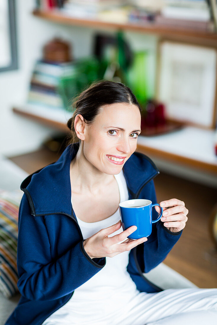 Woman drinking hot beverage