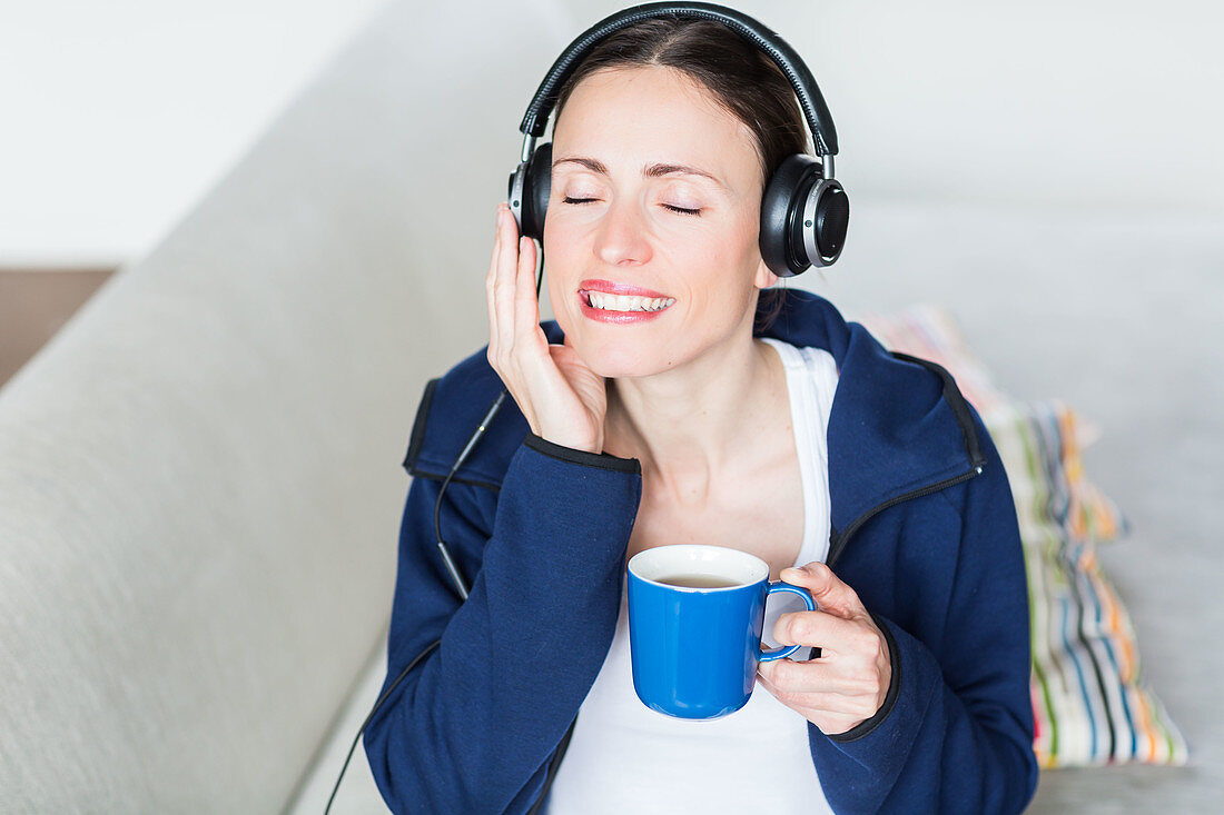 Woman drinking hot beverage