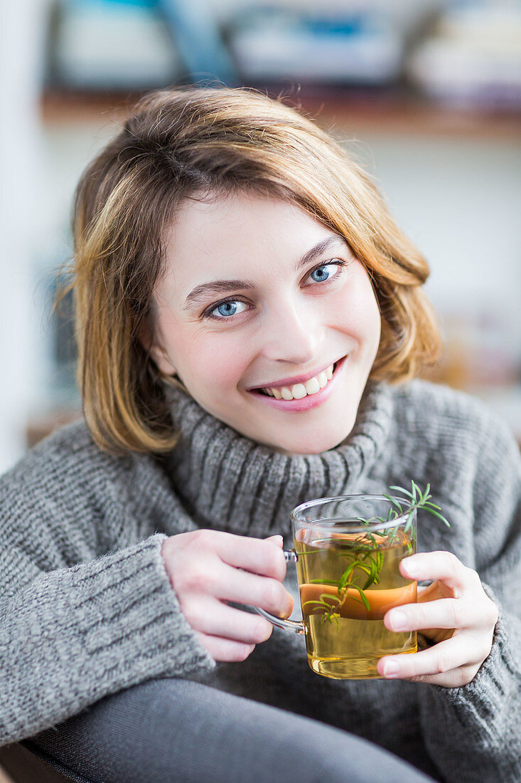 Woman drinking rosemary tea