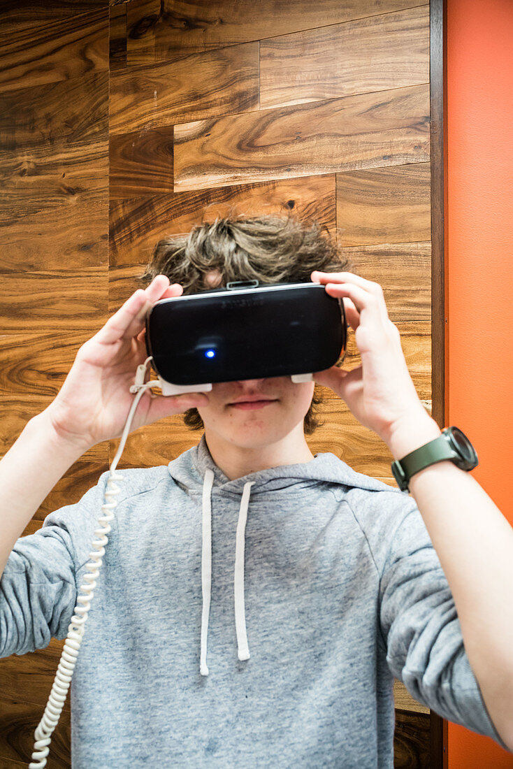 Teenager wearing a virtual reality headset