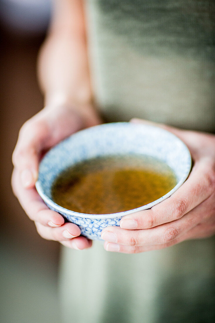 Woman drinking hot beverage