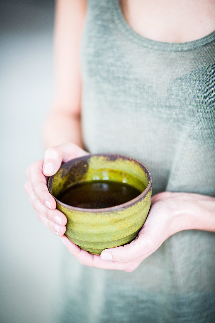 Woman drinking hot beverage